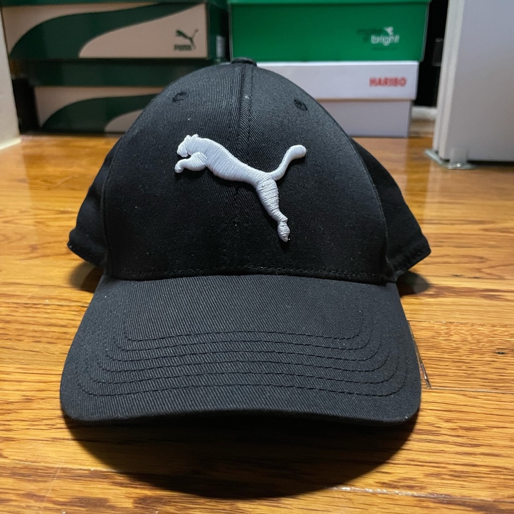Unisex black puma hat with white logo worn in great condition